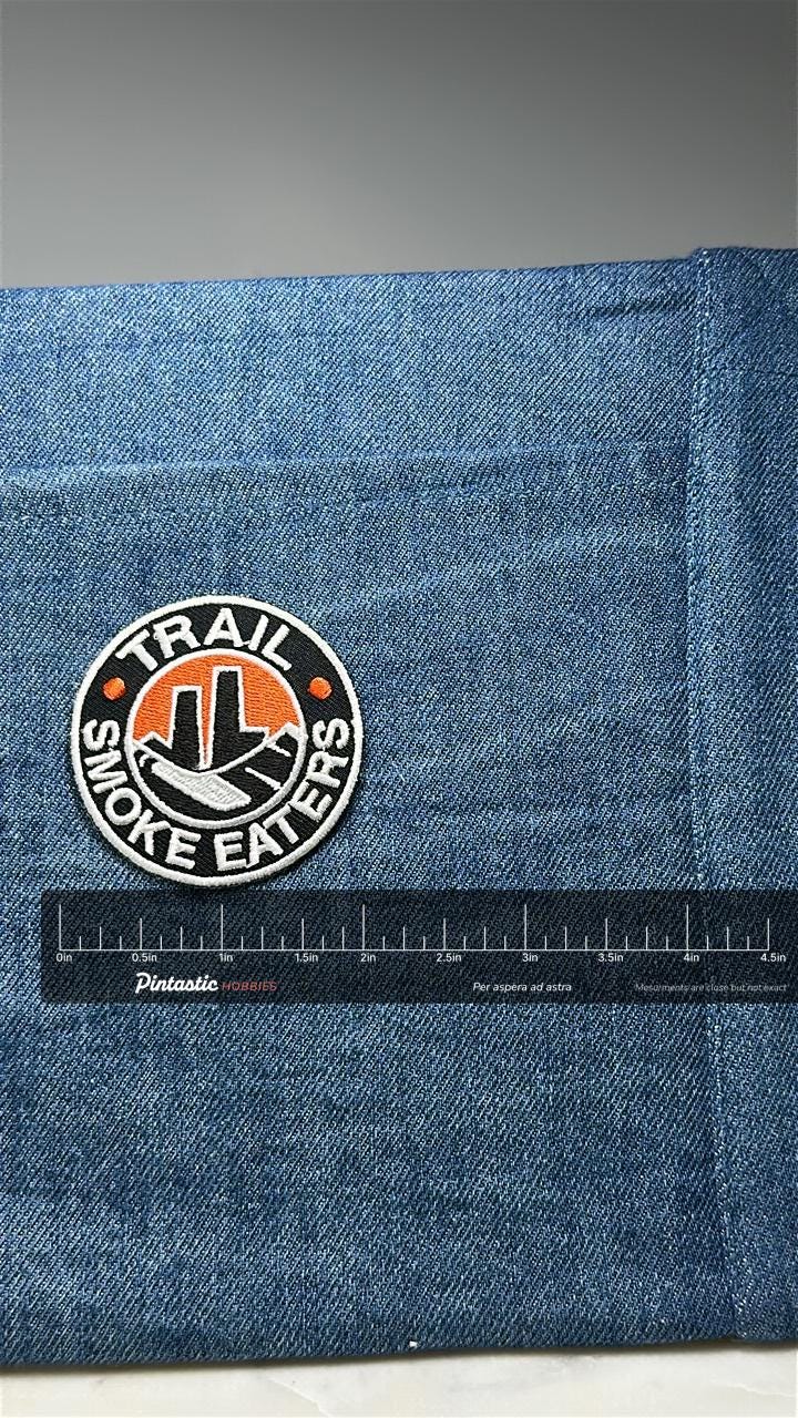 Vintage Trail Smoke Eaters Patch: Embroidered Black Orange - Hockey Souvenir with ruler overlay for size reference