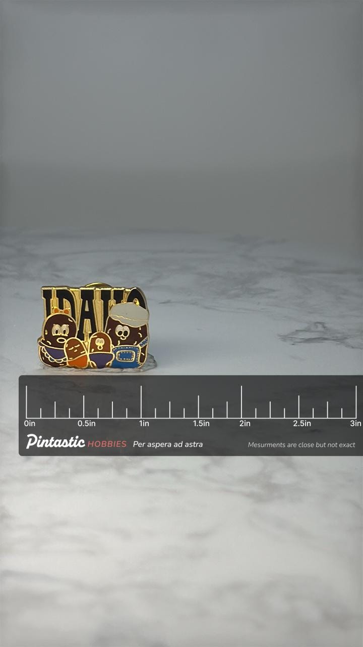 Vintage Idaho Potato Enamel Pin: Gold Tone - State Souvenir Accessory with ruler overlay for size reference