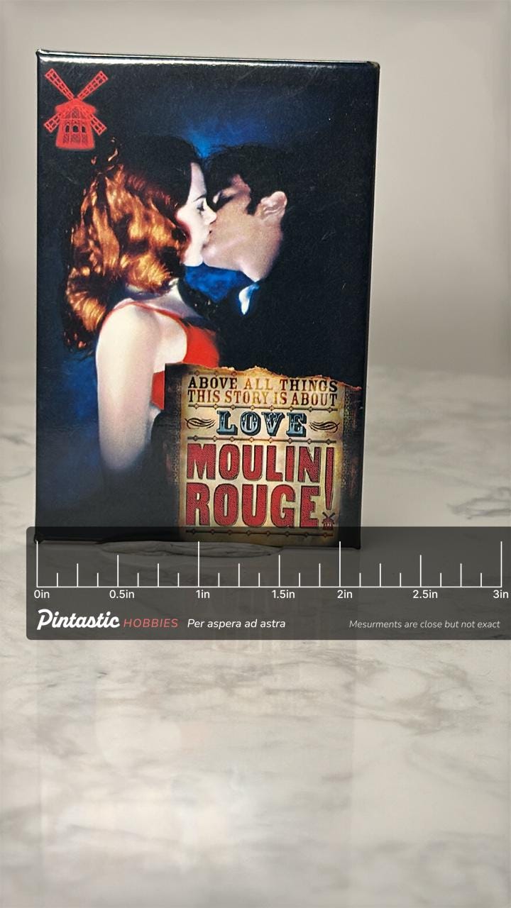 Vintage Moulin Rouge Movie Pin: Color Photo Finish - 2000s Film Accessory with ruler overlay for size reference