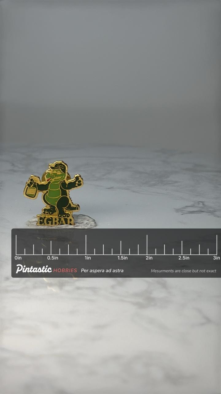 Vintage EGBAR Alligator Mascot Pin: Green Enamel Gold Tone - Advertising Accessory with ruler overlay for size reference