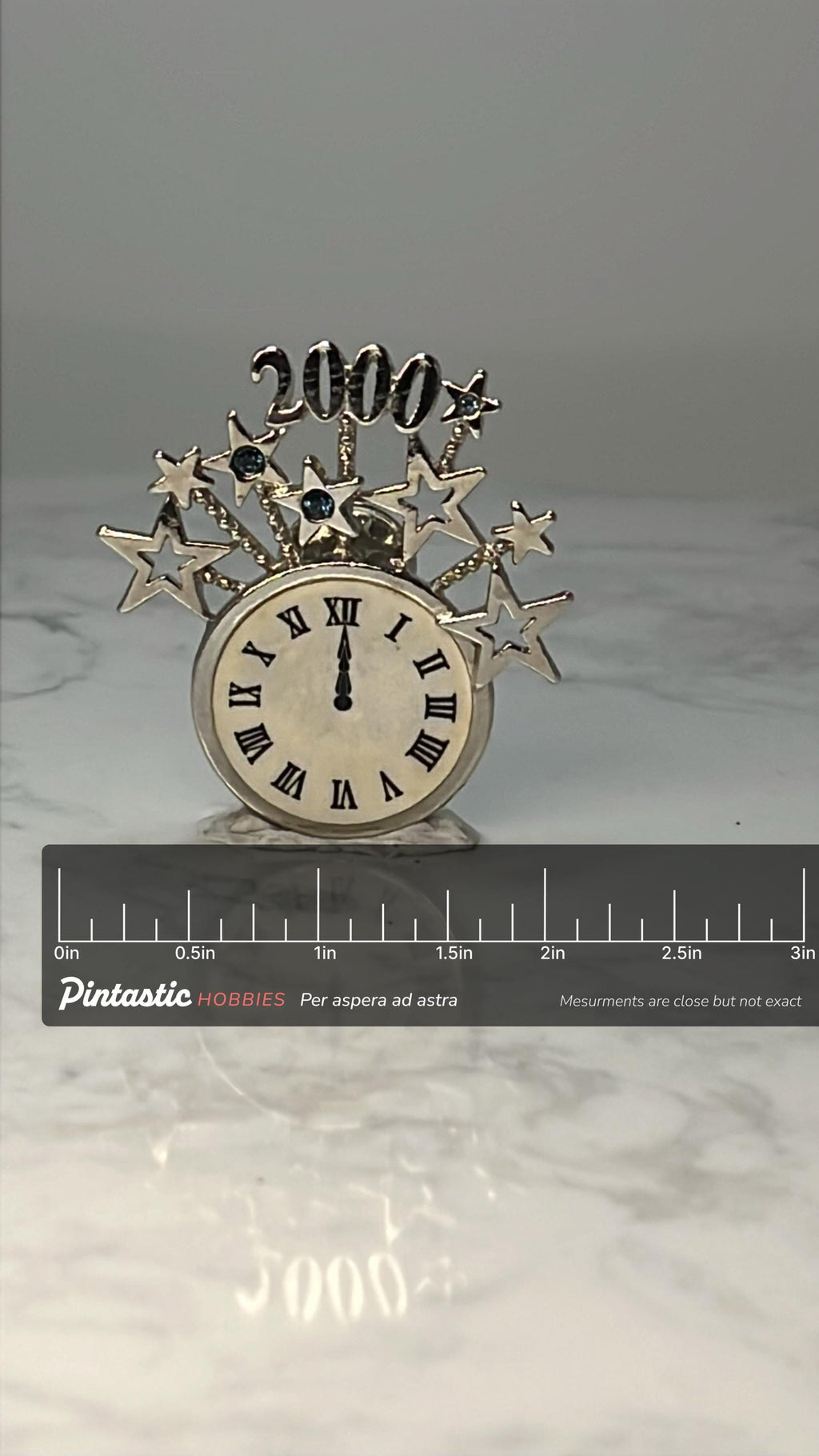 Vintage 2000 Millennium Clock Pin: Gold Tone Starburst - Y2K Accessory with ruler overlay for size reference