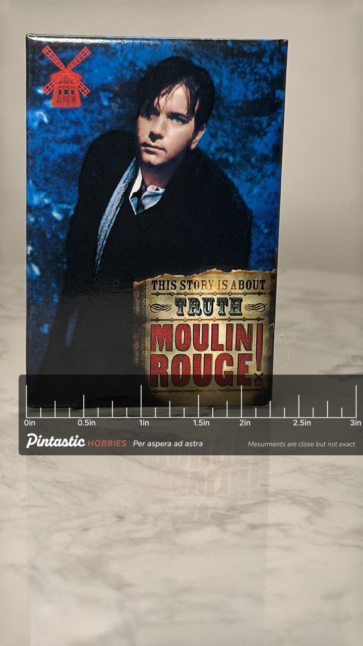 Vintage Moulin Rouge Movie Pin: Glossy Photo Finish - 2000s Film Accessory with ruler overlay for size reference