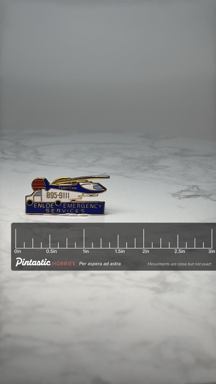 Vintage Enloe Emergency Services Helicopter Pin: Gold Tone - Medical Aviation Accessory with ruler overlay for size reference