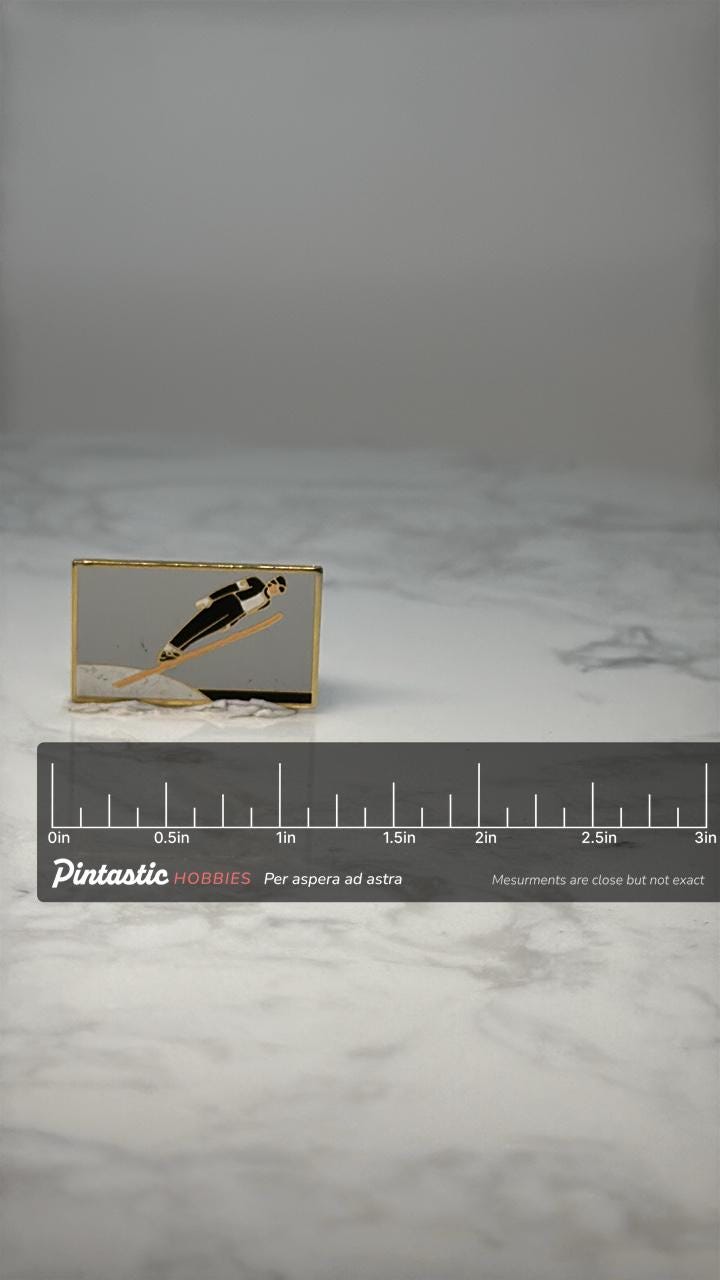 Vintage Ski Jumper Enamel Pin: Gold Tone - Winter Sports Accessory with ruler overlay for size reference
