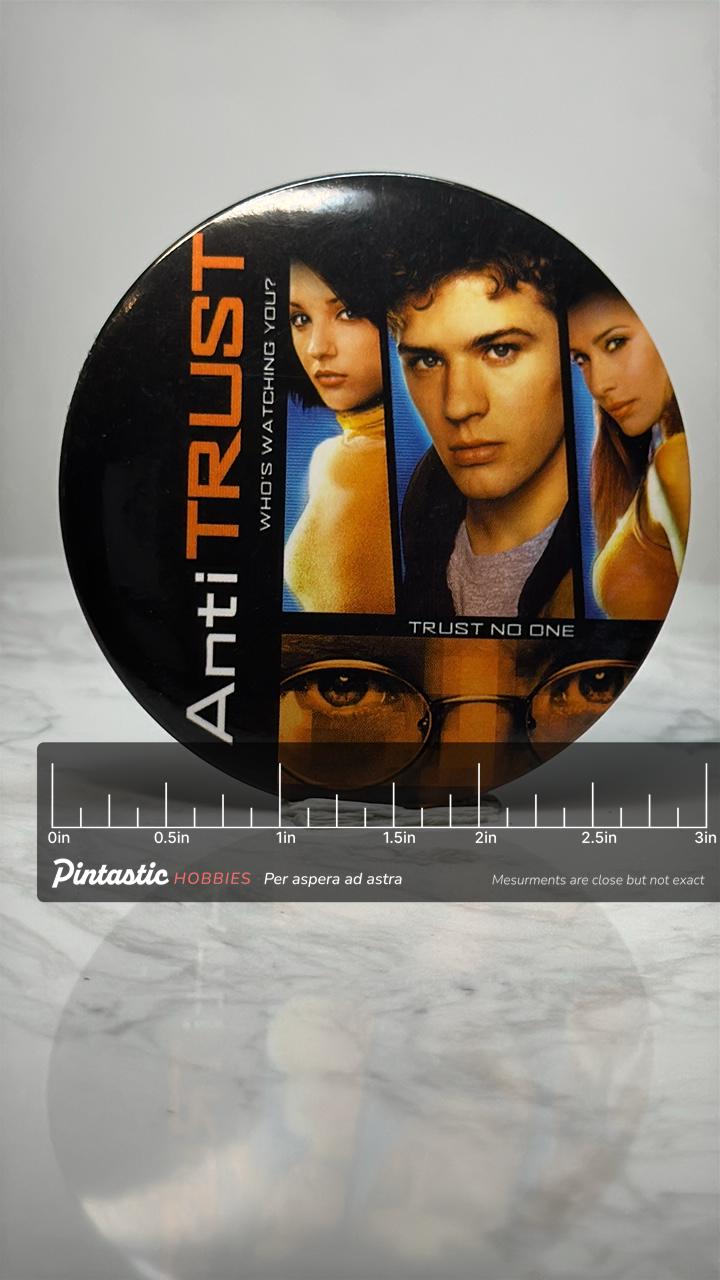 Vintage Antitrust Movie Pin: Glossy Photo Button - 2000s Thriller Accessory with ruler overlay for size reference