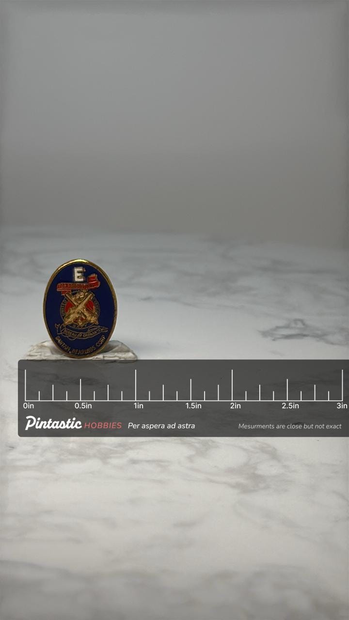 Vintage Fire Ordnance E Award Pin: Blue Enamel - WWII Accessory with ruler overlay for size reference