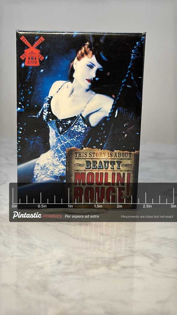 Vintage Moulin Rouge Movie Pin: Glossy Photo Finish - 2000s Film Accessory with ruler overlay for size reference