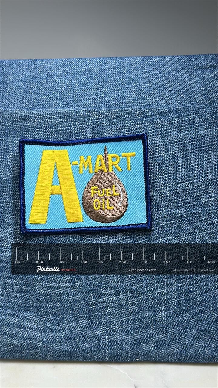A-Mart Fuel Oil Patch: Blue Border - Gas Station Accessory with ruler overlay for size reference