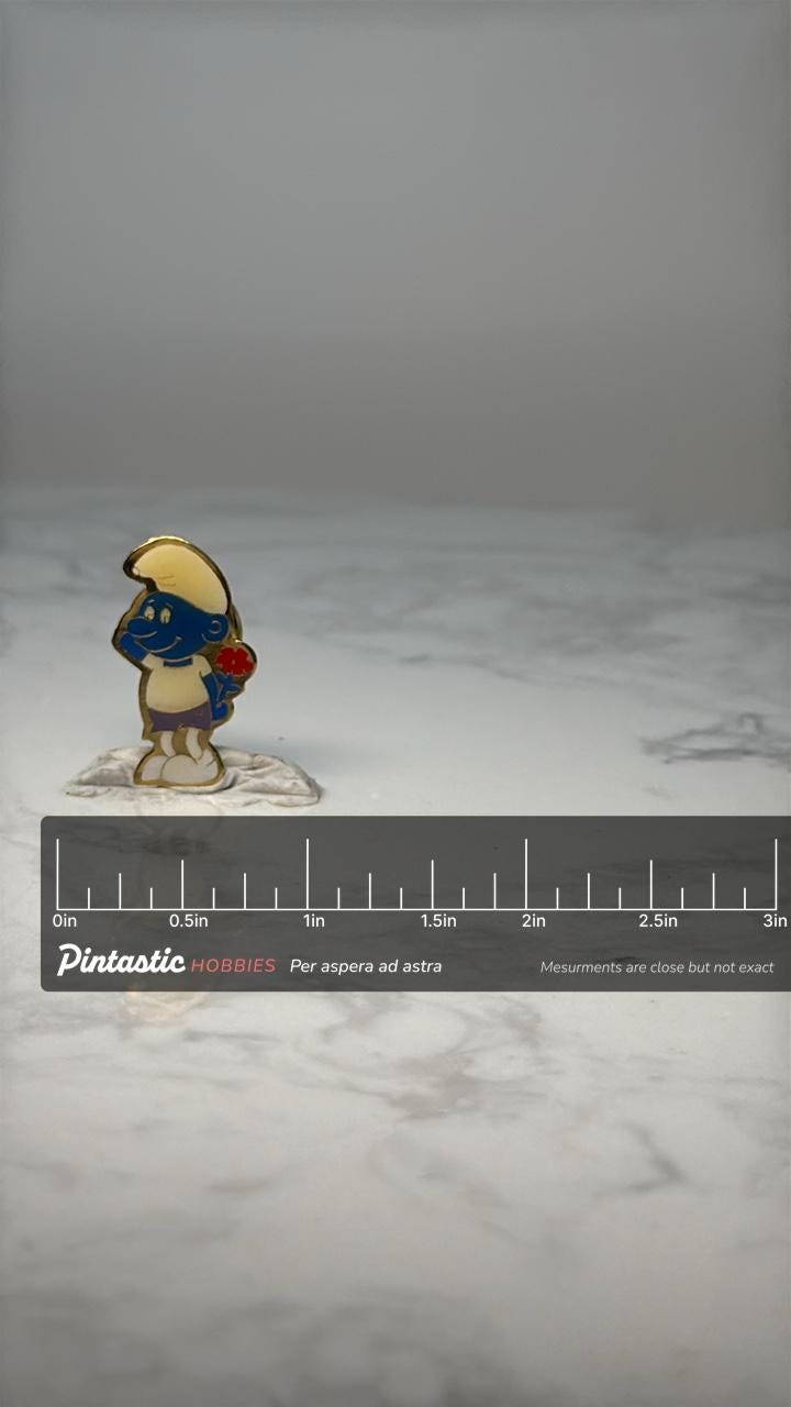 Vintage Papa Smurf Enamel Pin: Blue & Gold Tone - 1980s Cartoon Accessory with ruler overlay for size reference