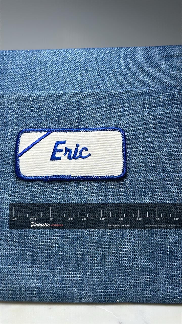 Eric Name Patch: Blue Script on White - Vintage Uniform Accessory with ruler overlay for size reference