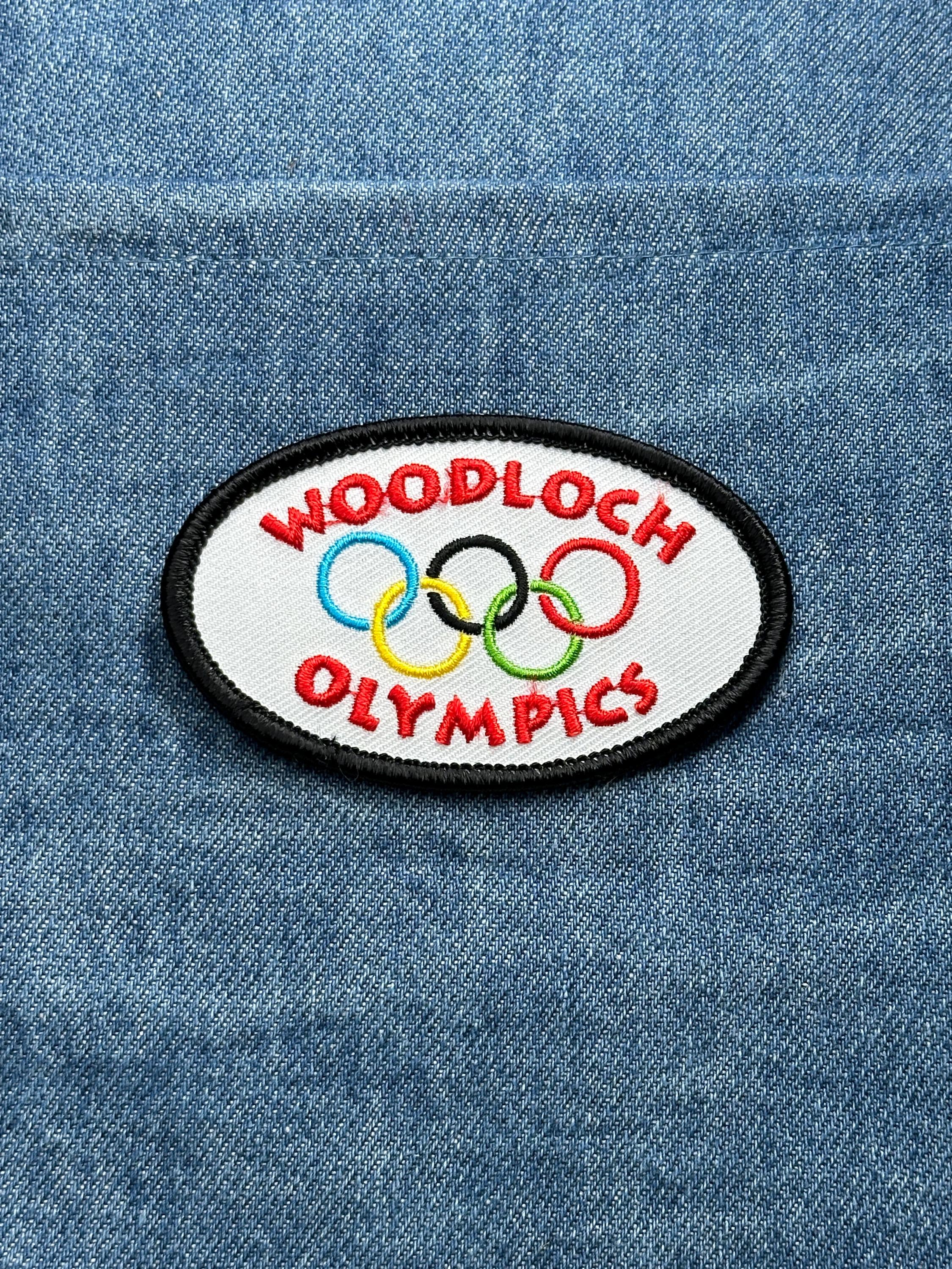 Woodloch Olympics Patch: Multicolor Oval - Resort Sports Accessory