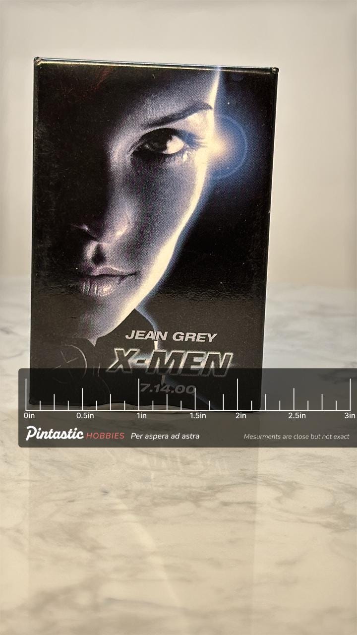 Vintage X Men Jean Grey Movie Pin: Glossy Promo - 2000 Film Accessory with ruler overlay for size reference