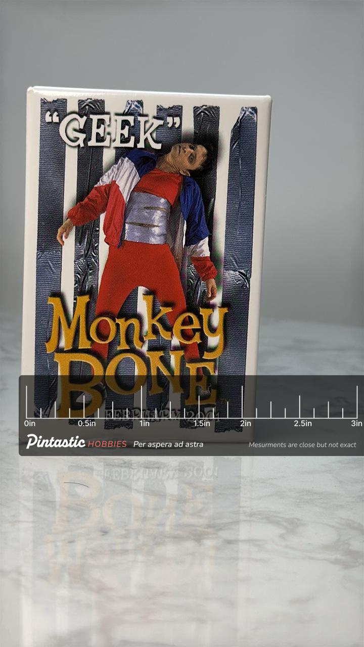 Vintage Monkeybone Movie Pin: Glossy Graphic - 2000s Film Accessory with ruler overlay for size reference