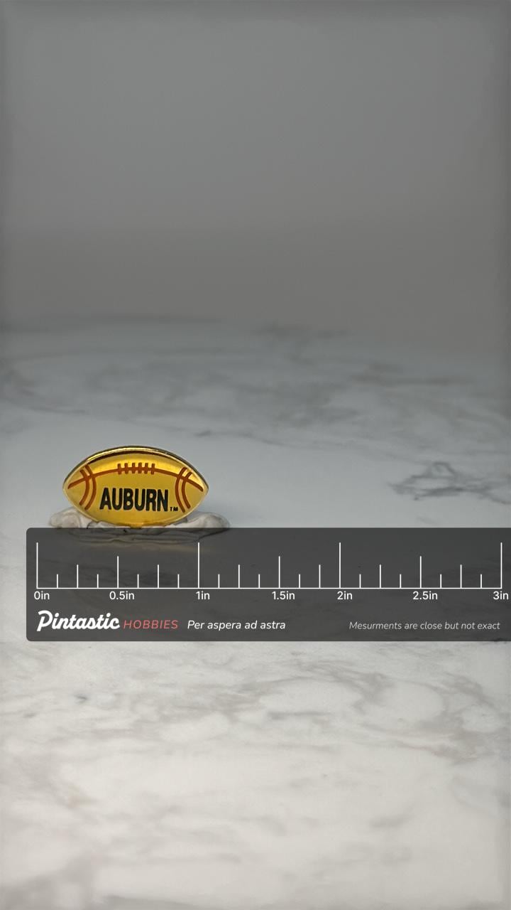Vintage Auburn Football Pin: Yellow Acrylic - College Sports Accessory with ruler overlay for size reference
