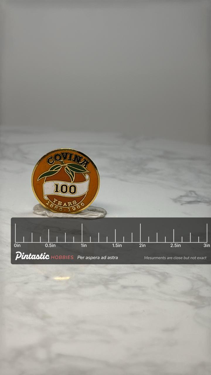 Vintage Covina Centennial Pin: Orange Enamel - 100 Years 1886-1986 with ruler overlay for size reference