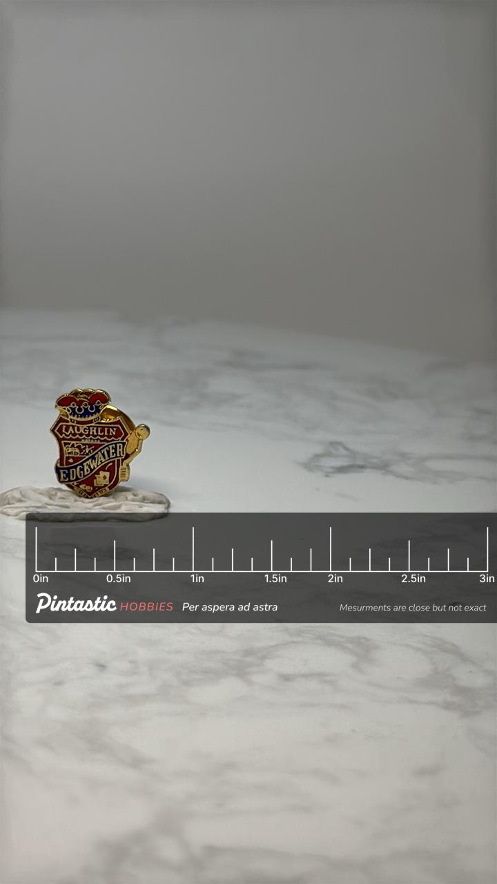 Vintage Laughlin Edgewater Casino Pin: Red & Gold Enamel - Nevada Souvenir with ruler overlay for size reference