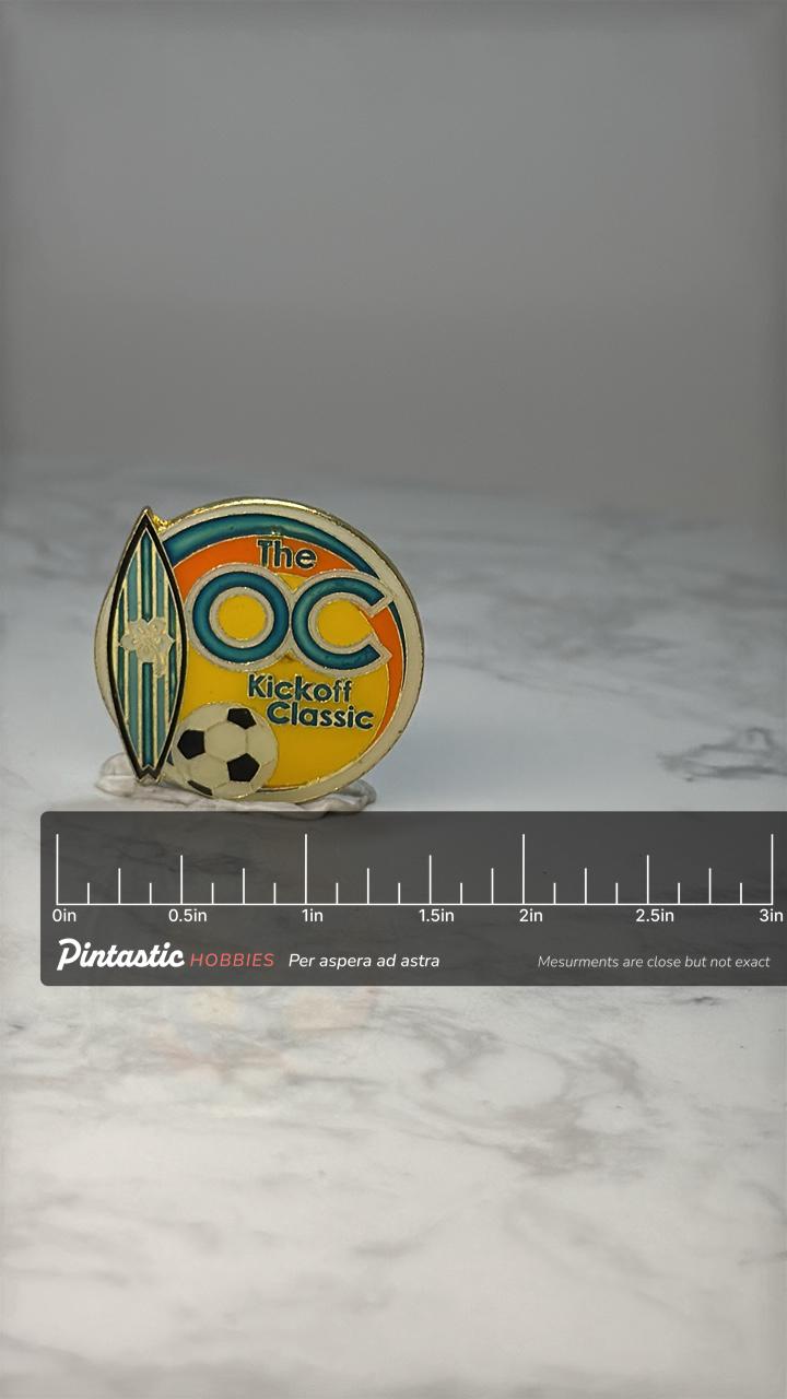 Vintage The OC Kickoff Classic Pin: Enamel Gold Tone - Soccer Event Accessory with ruler overlay for size reference