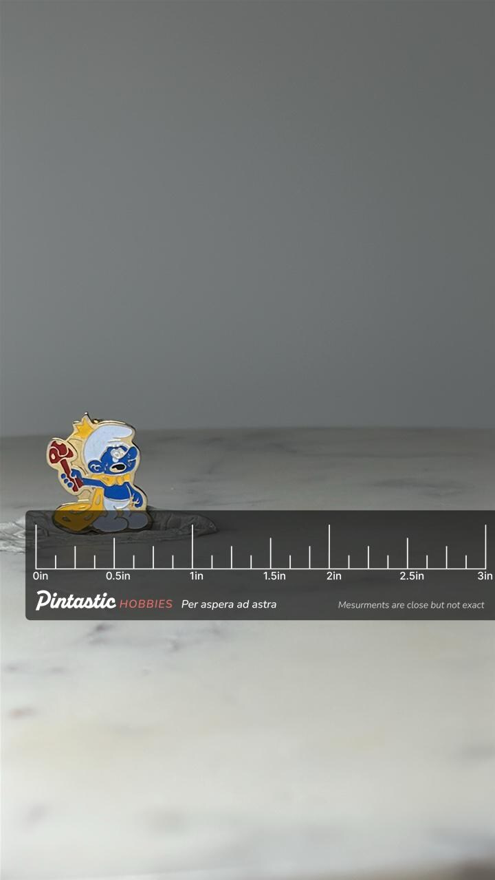 Vintage Smurf King Enamel Lapel Pin: Gold Tone - 1980s Cartoon Accessory with ruler overlay for size reference