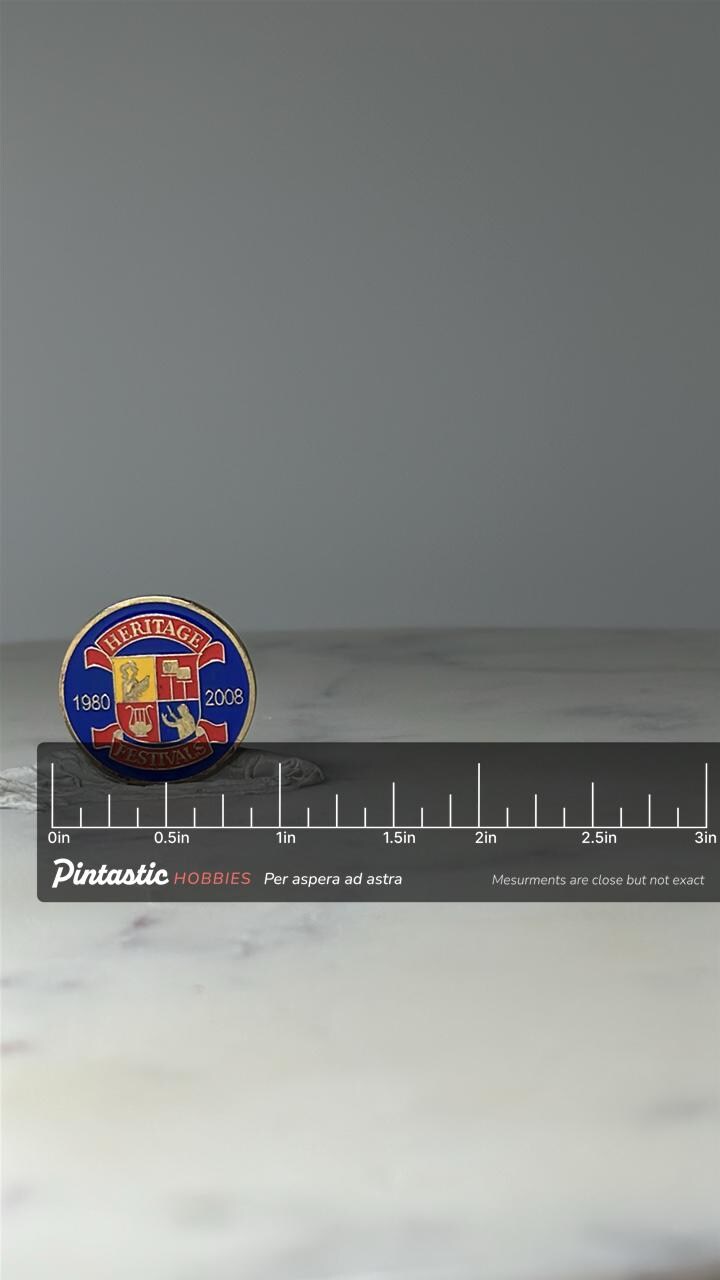 Vintage Heritage Festivals Enamel Pin: Blue Red Gold - 1980–2008 Commemorative Accessory with ruler overlay for size referenc