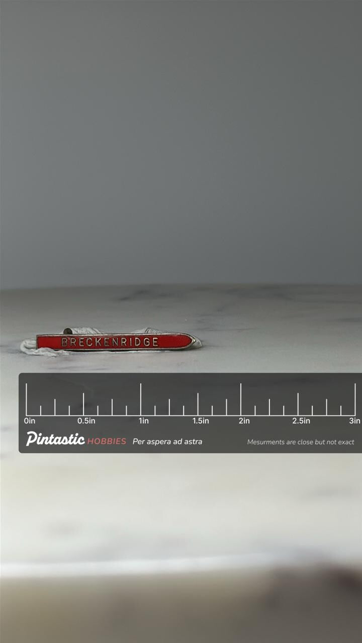 Vintage Breckenridge Souvenir Pin: Red Enamel Bar - Ski Town Accessory with ruler overlay for size reference