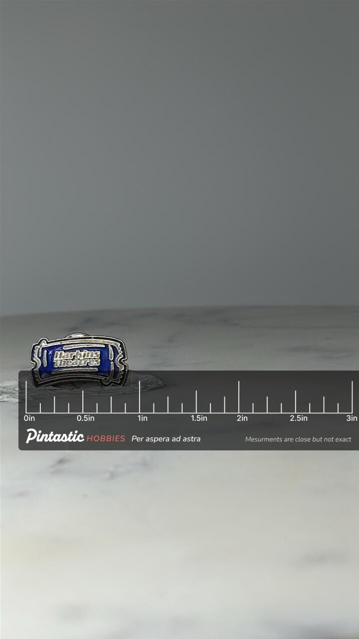Vintage Harkins Theatres Ticket Pin: Blue Enamel - Cinema Souvenir Accessory with ruler overlay for size reference