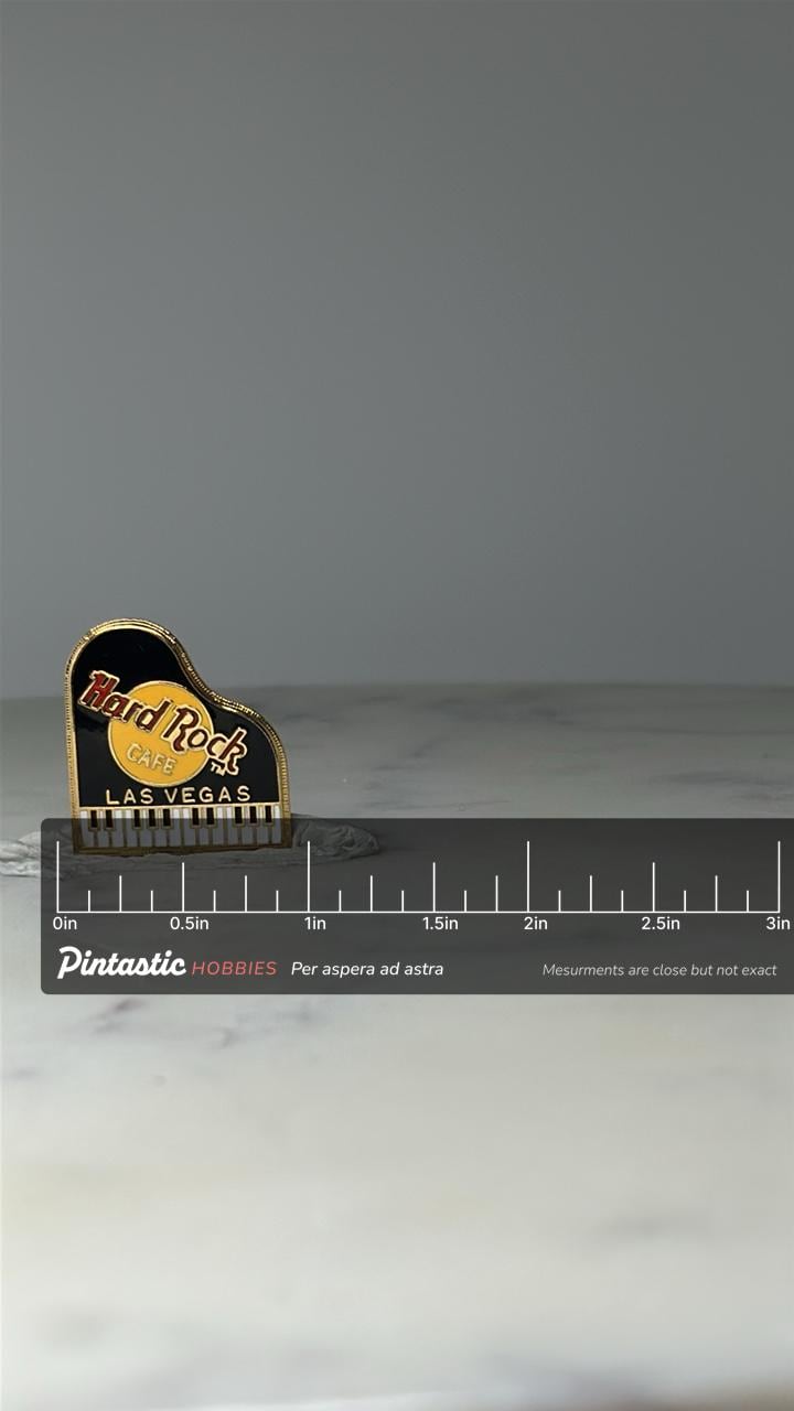 Vintage Hard Rock Cafe Piano Pin: Black & Gold Enamel - Las Vegas Souvenir Accessory with ruler overlay for size reference