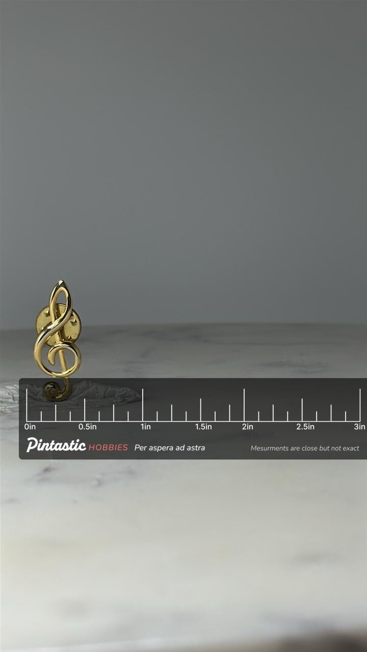 Vintage Treble Clef Lapel Pin: Gold Tone Metal - Music Lover Accessory with ruler overlay for size reference
