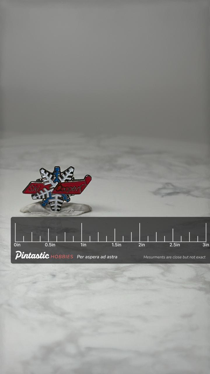 Vintage Ski Cooper Souvenir Lapel Pin: Enamel Snowflake - Ski Resort Accessory with ruler overlay for size reference