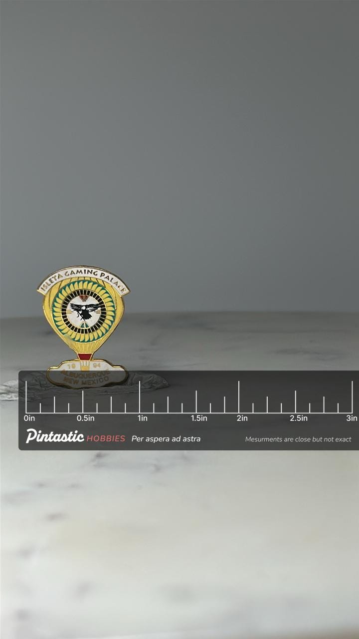 Vintage Isleta Gaming Palace Enamel Pin: Gold Tone - New Mexico Souvenir Accessory with ruler overlay for size reference