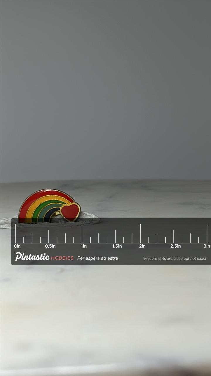 Vintage Rainbow Heart Enamel Pin: Gold Tone - Retro Love Accessory with ruler overlay for size reference