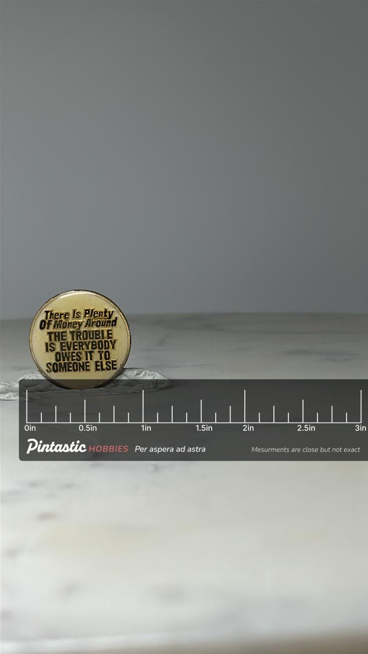 Vintage Money Quote Lapel Pin: Gold Tone Enamel - Retro Humor Accessory with ruler overlay for size reference