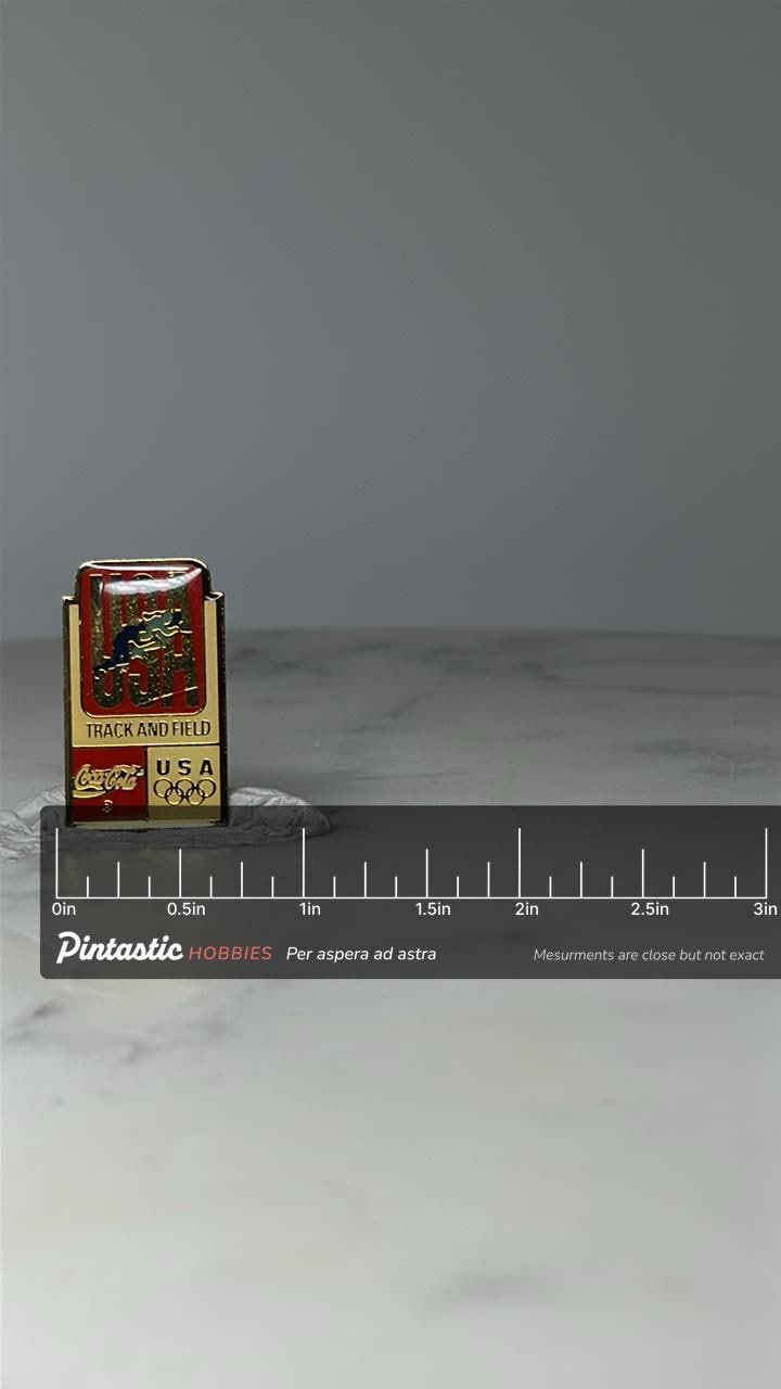 Vintage USA Track & Field Enamel Pin: Red Gold - Olympic Theme Accessory with ruler overlay for size reference