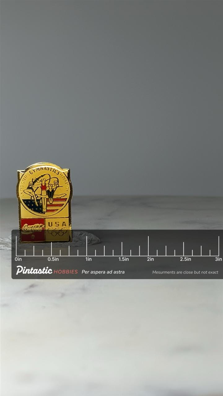 Vintage USA Gymnastics Olympic Pin: Gold Enamel - Coca Cola Sponsor with ruler overlay for size reference