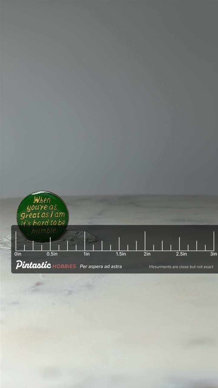 Vintage Humorous Quote Lapel Pin: Green Enamel Gold Tone - Retro Accessory with ruler overlay for size reference