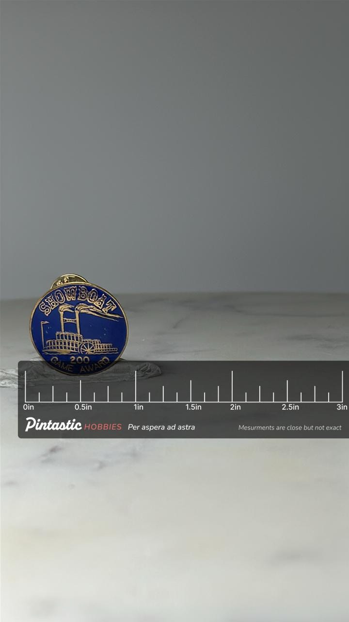 Vintage Showboat 200 Game Award Pin: Blue Enamel - Casino Employee with ruler overlay for size reference