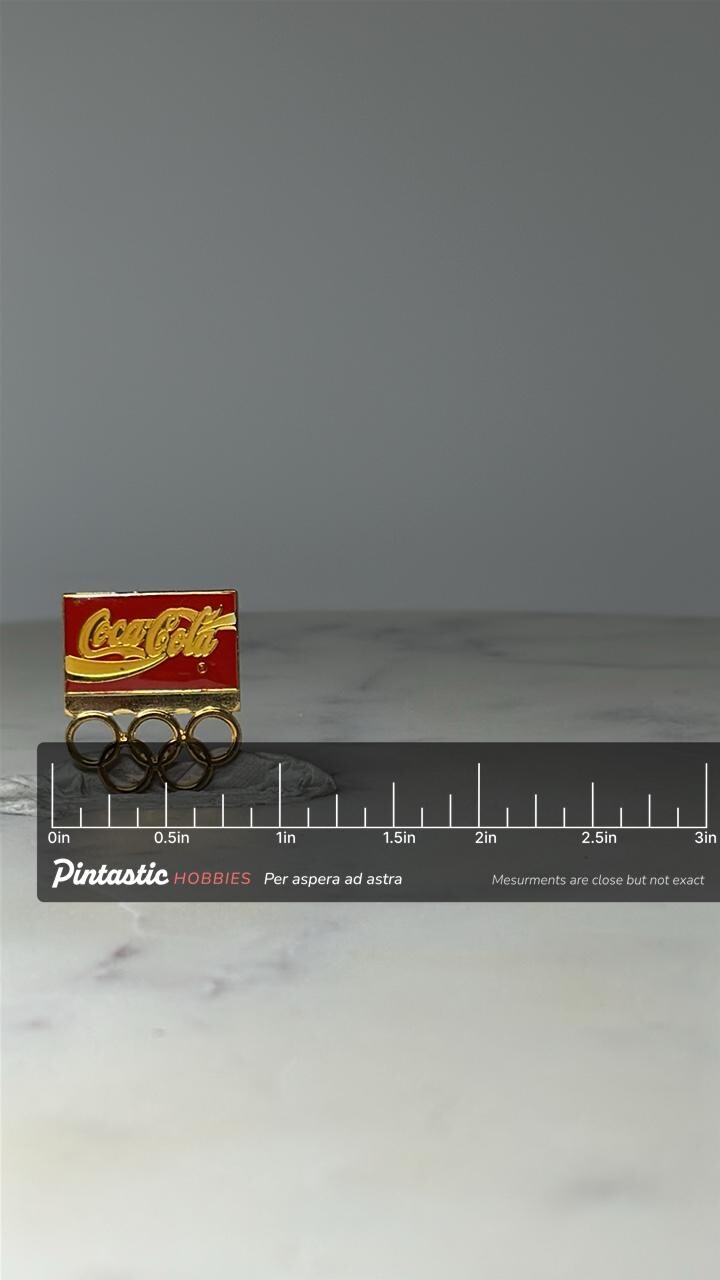 Vintage Coca Cola Olympic Rings Pin: Red & Gold Enamel - 1990s with ruler overlay for size reference