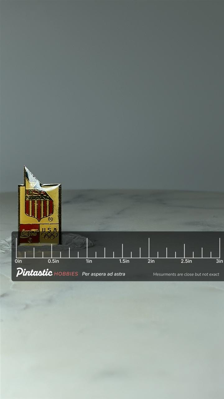 Vintage USA Swimming Olympic Pin: Gold Enamel - Coca Cola Sponsor with ruler overlay for size reference