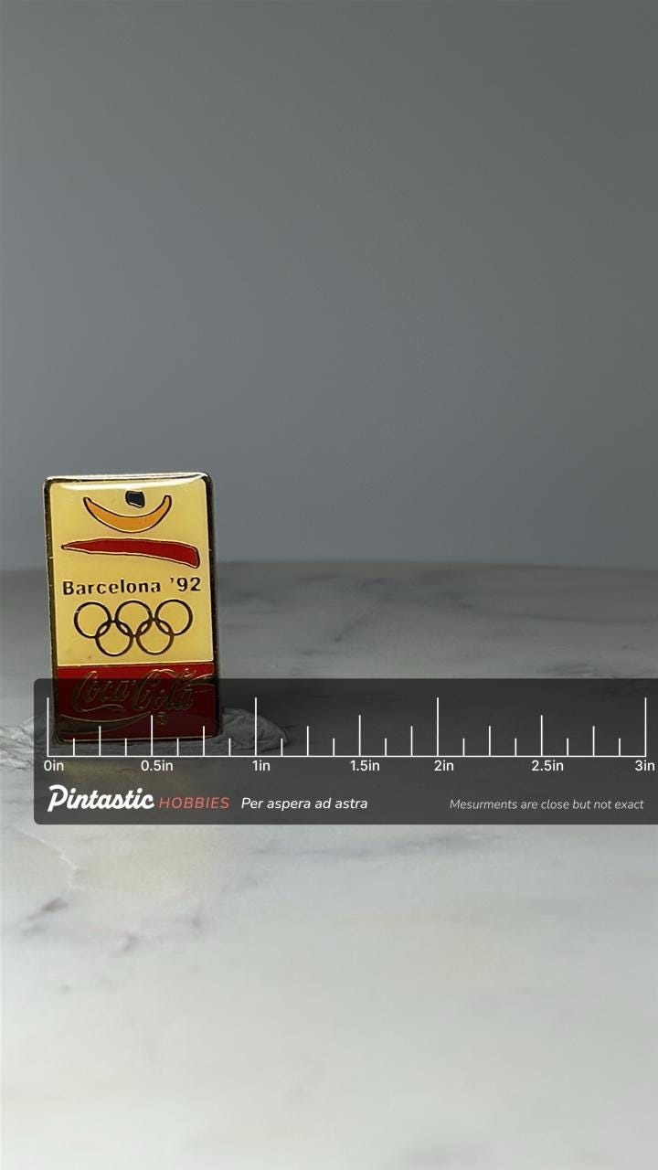 Vintage Barcelona 92 Olympic Pin: Gold Enamel - Coca Cola Sponsor with ruler overlay for size reference