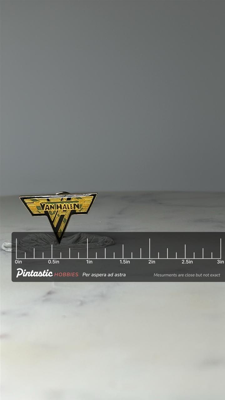 Vintage Van Halen Logo Enamel Pin: Gold & Green - 1980s Rock Accessory with ruler overlay for size reference