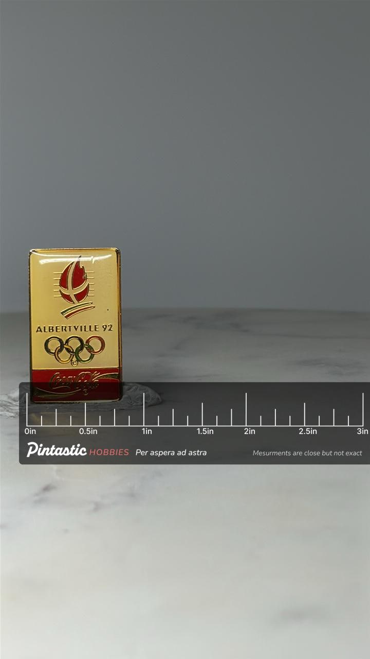 Vintage Albertville 92 Olympic Pin: Gold Tone Enamel - Coca Cola Sponsor with ruler overlay for size reference