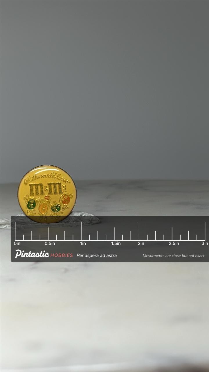 Vintage M&M’s Candy Pin: Yellow Enamel - 1990s Advertising Accessory with ruler overlay for size reference
