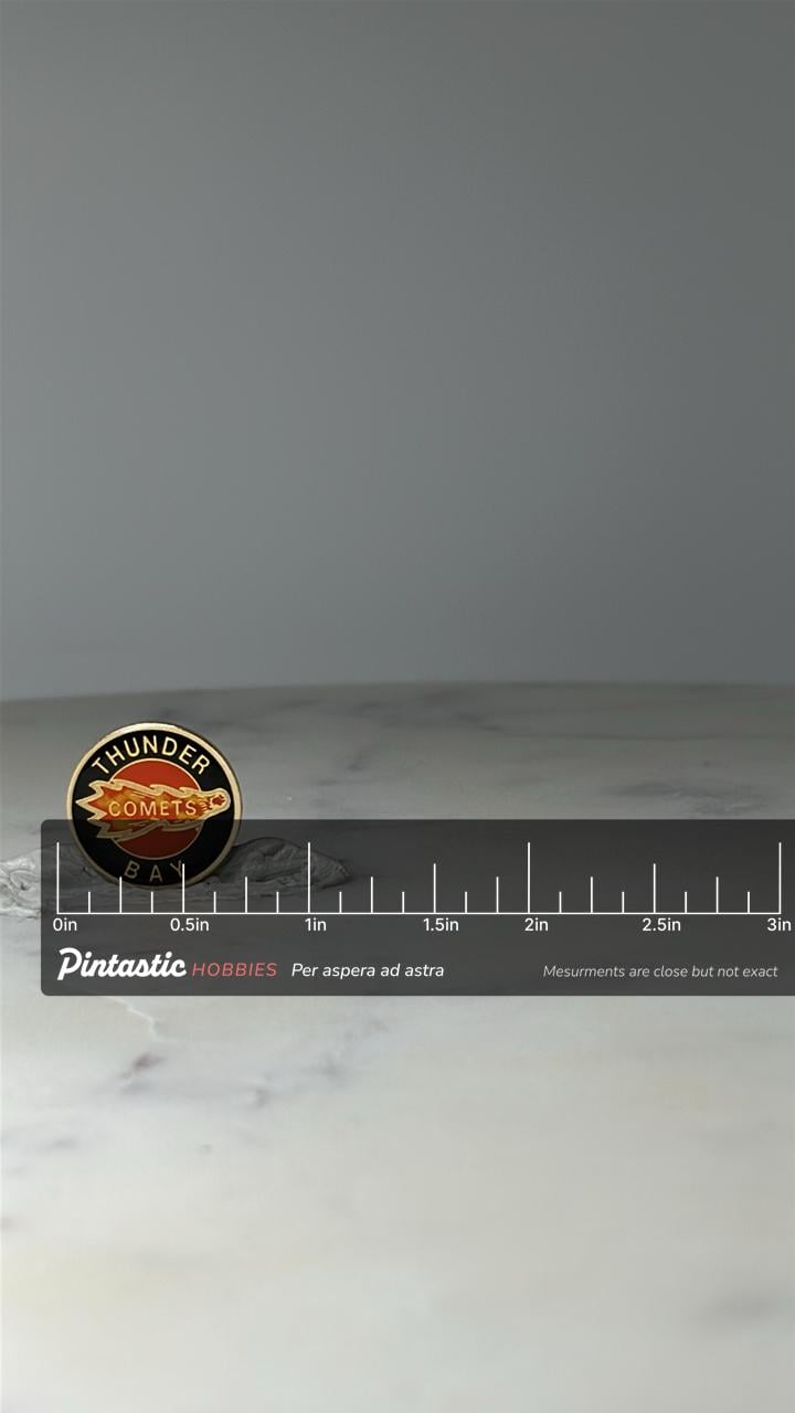 Vintage Thunder Bay Comets Enamel Pin: Black Orange - 1990s Sports Accessory with ruler overlay for size reference