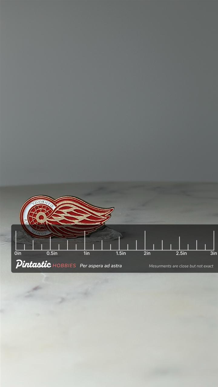 Vintage Toronto Red Wings Logo Pin: Red Enamel - NHL Hockey Accessory with ruler overlay for size reference