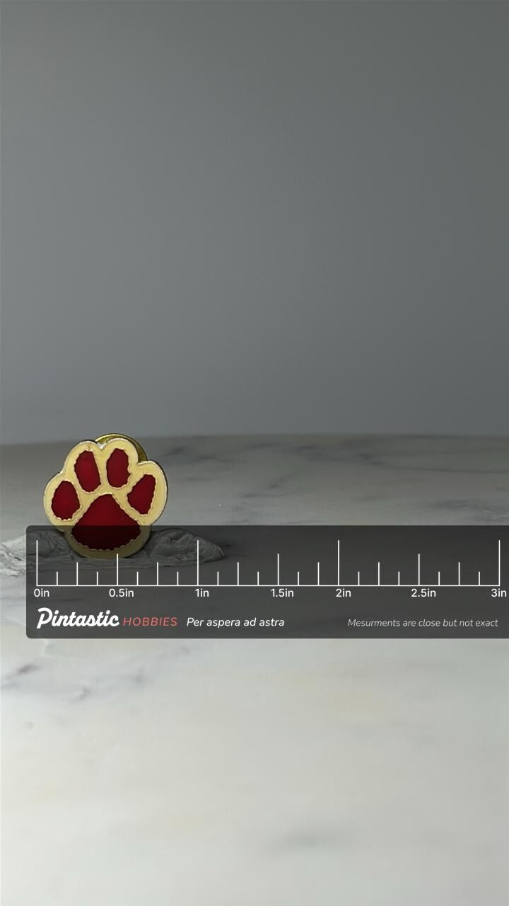 Vintage Red Paw Print Enamel Pin: Gold Tone - Animal Lover Accessory with ruler overlay for size reference