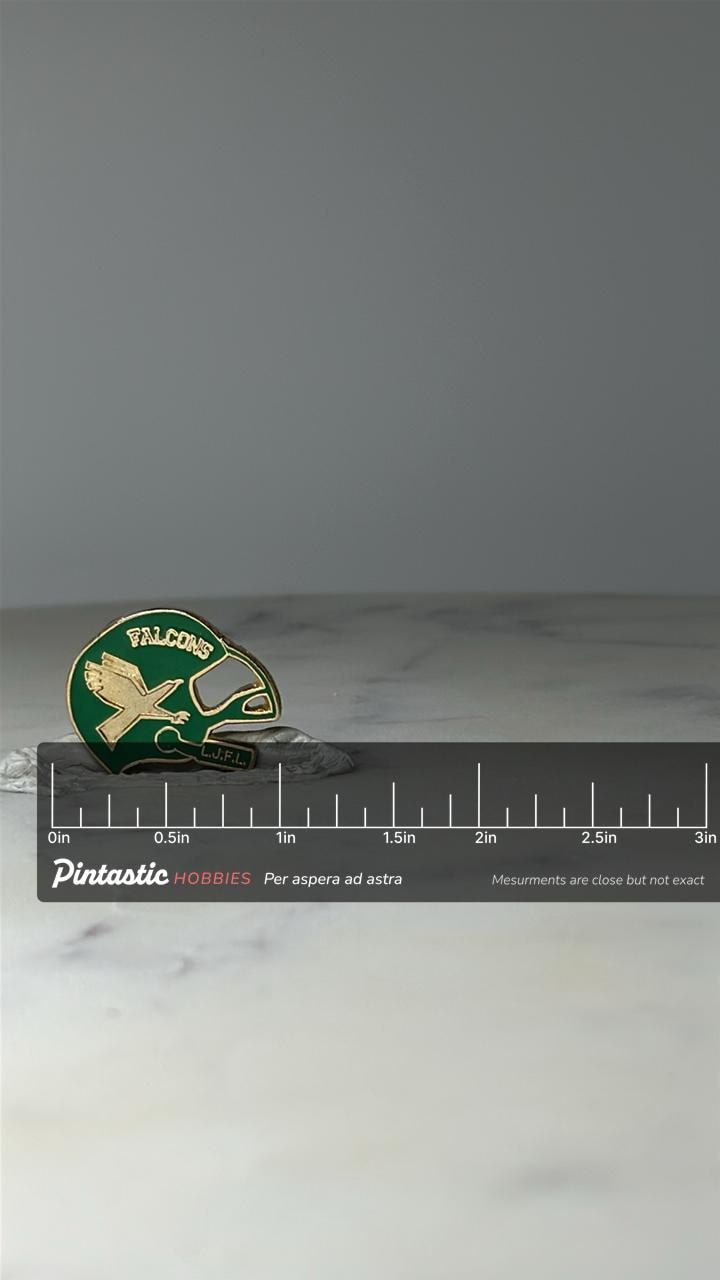 Vintage Falcons Football Helmet Pin LJFL Youth League Enamel Lapel Hat Pin with ruler overlay for size reference