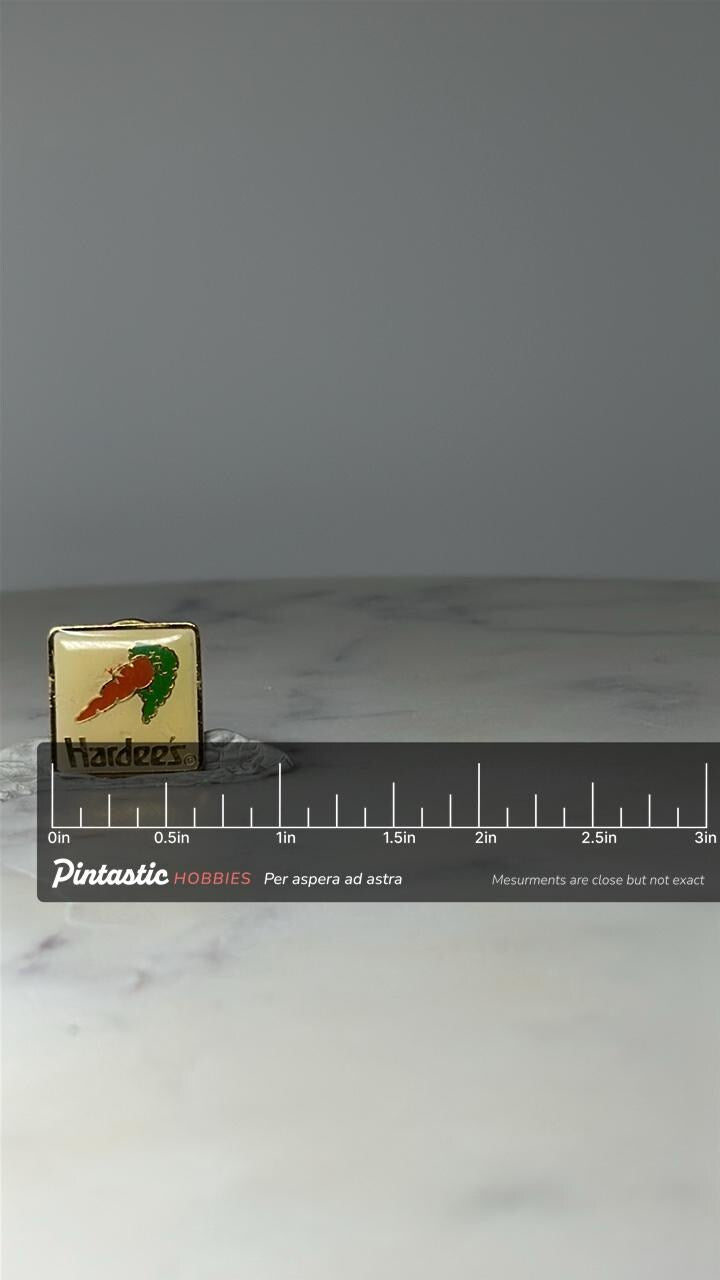 Vintage Hardees Logo Lapel Pin: Gold Tone Enamel - 1980s Fast Food Accessory with ruler overlay for size reference
