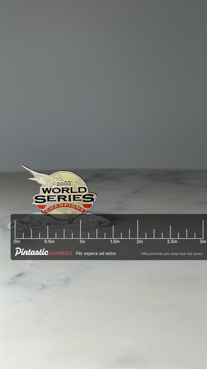 Vintage 2003 World Series Champions Lapel Pin: Gold Tone - MLB Baseball with ruler overlay for size reference
