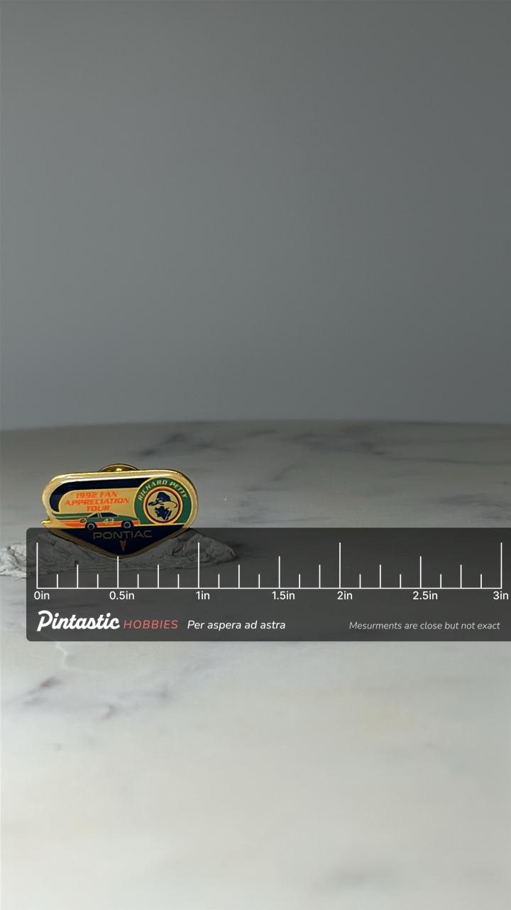 Vintage 1992 Richard Petty Pontiac Pin: Gold Enamel - NASCAR Accessory with ruler overlay for size reference