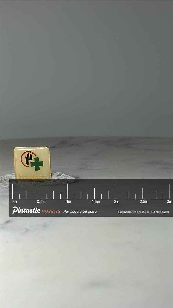 Vintage Hardees Safety Award Lapel Pin: Gold Tone Enamel - 1980s Company Accessory with ruler overlay for size reference