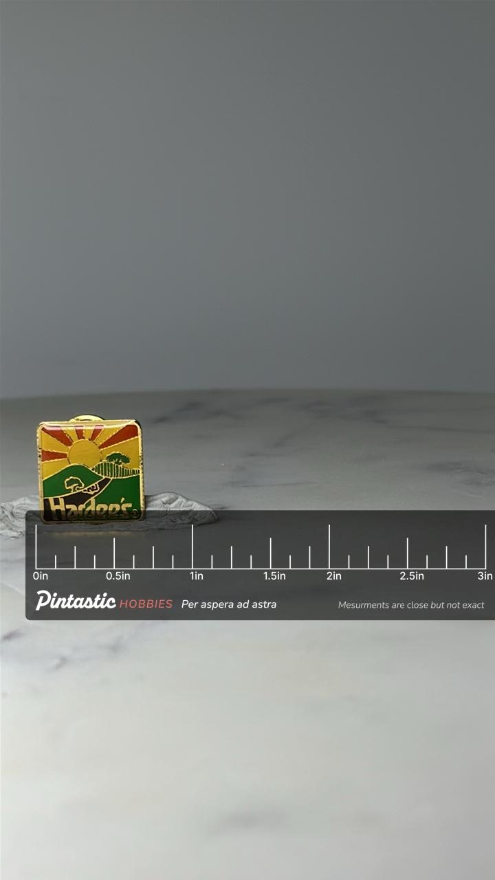 Vintage Hardees Sunset Logo Enamel Pin: Gold Tone - 1980s Restaurant Promo with ruler overlay for size reference